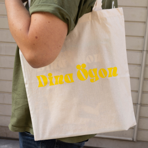 Dina Ögon - Totebag - Natural with yellow Logo i gruppen MERCHANDISE / Merch / RnB-Soul hos Bengans Skivbutik AB (4410138)